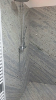 Open-book wall cladding in Kashmir White granite